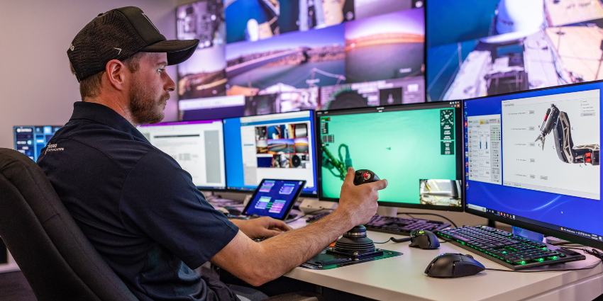 Image of a man demonstrating remote operations at Fugro SPAARC