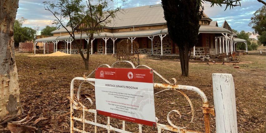 Heritage grants program sign in front of a heritage property