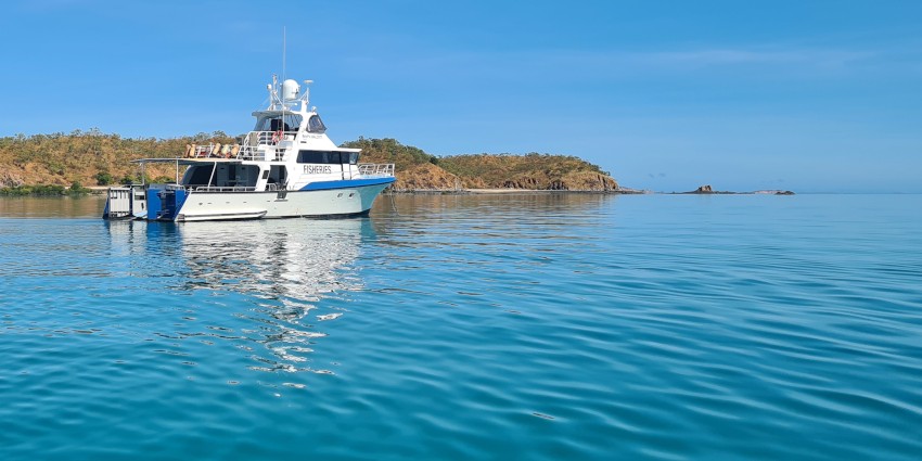 A DPIRD Fisheries research vessel in the ocean.