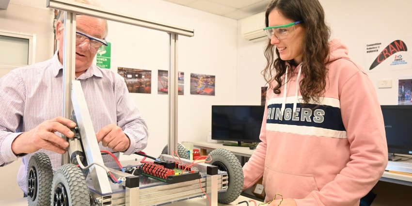 Dr Berryman and Victoria Ledger (student) in Murdoch robot lab building a robot