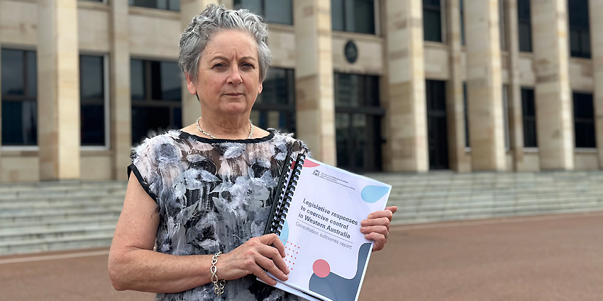 Commissioner for Victims of Crime holding the coercive control report