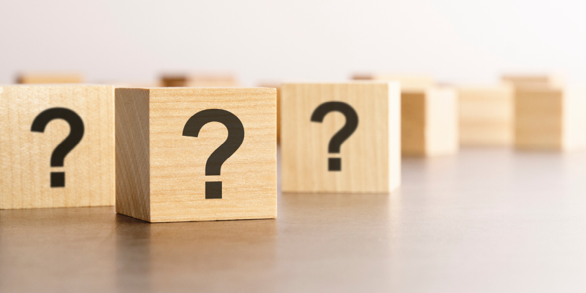 wooden blocks with question marks 