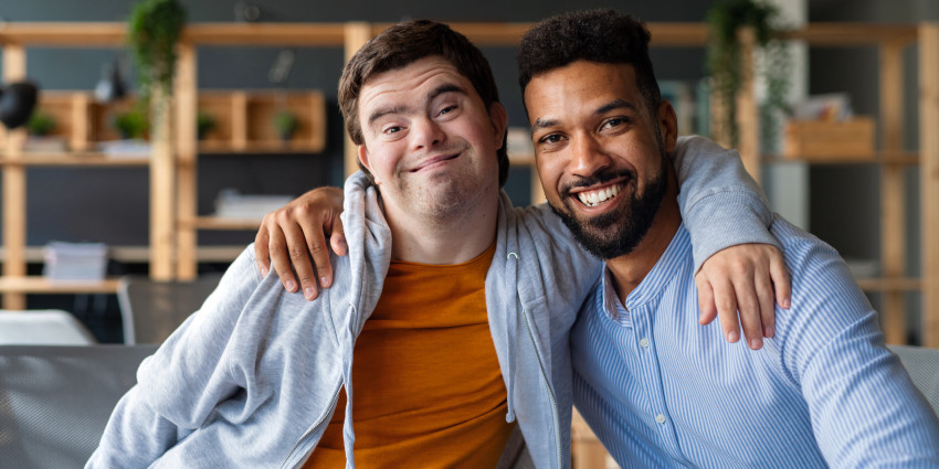 two young men, smiling