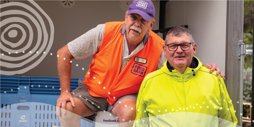 Photo of two middle age men who are food bank volunteers