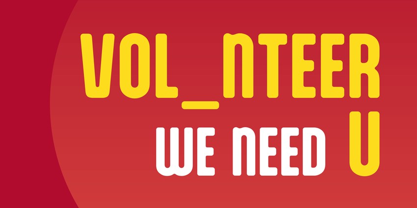 Banner with a red background with the words VOL_NTEER WE NEED U