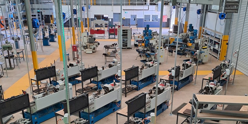 A view of Pundulmarra TAFE workshop with various machines and workstations.