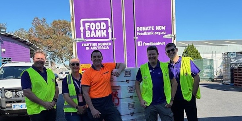 a group of recovery workers with Foodbank signage