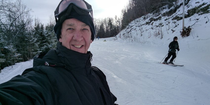Photo of an older man skiing