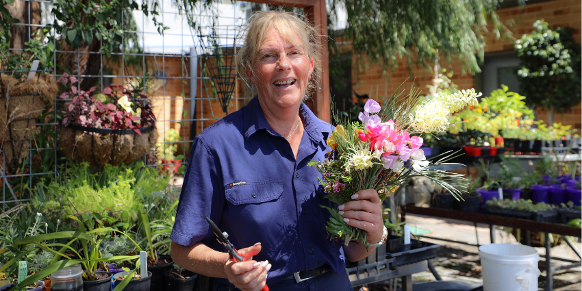 Vocational Support Officer Helen in the garden