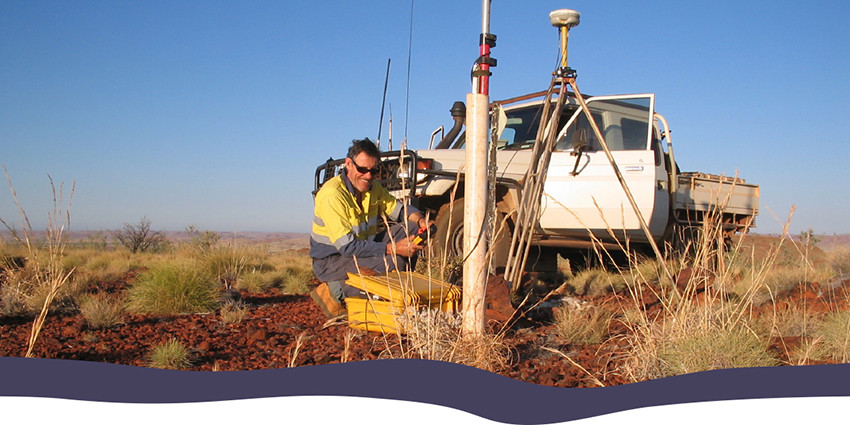 person in front of car in remote location