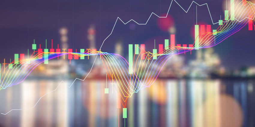 Line chart overlaid on photo of city at night depicting energy markets.