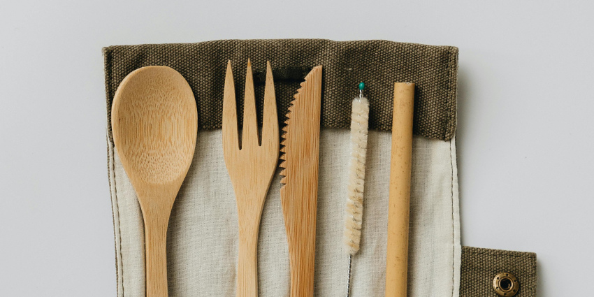 a pack of reusable utensils and a straw
