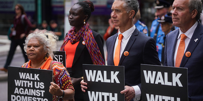 !6 Days March - Minister Toni Buti and Minister Witby holding signs at the March in Perth CBD