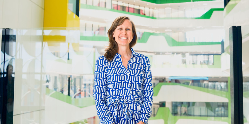 psa finalist asha bowen standing in the halls of The Kids Institute