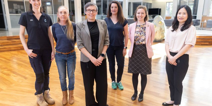 members of genetic assessment for conservation of rare and threated fauna project team standing in their office