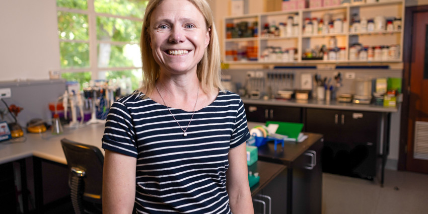 Jacqueline standing in her lab