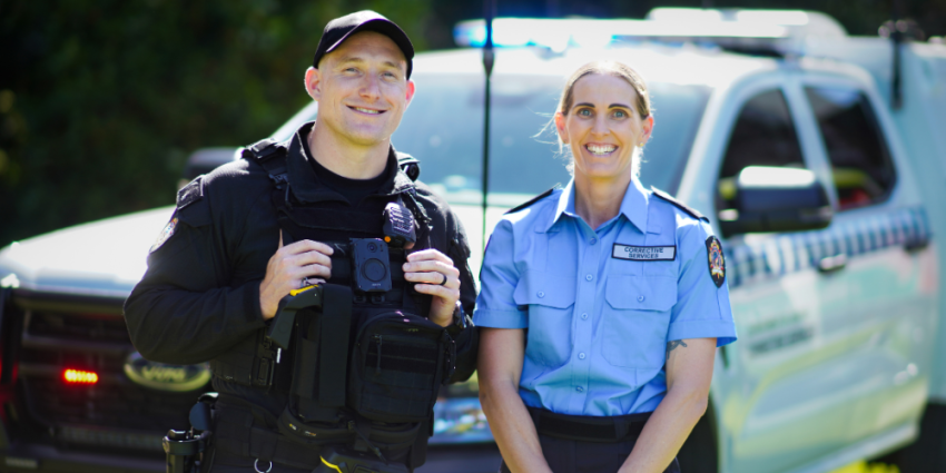 Special Operations Group officers in front of a patrol car
