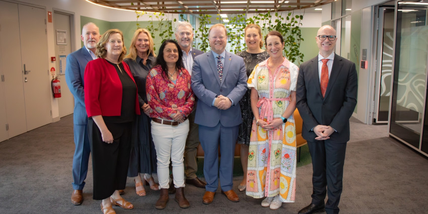 A group photo of Communities staff in an office environment