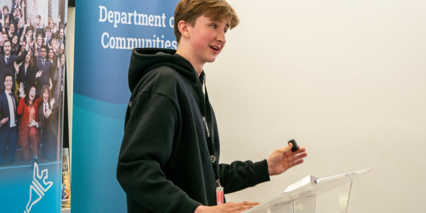 a young teenager giving a speech