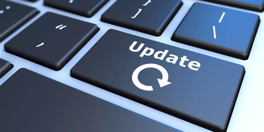 The word 'update' in white font on a black key of a computer keyboard