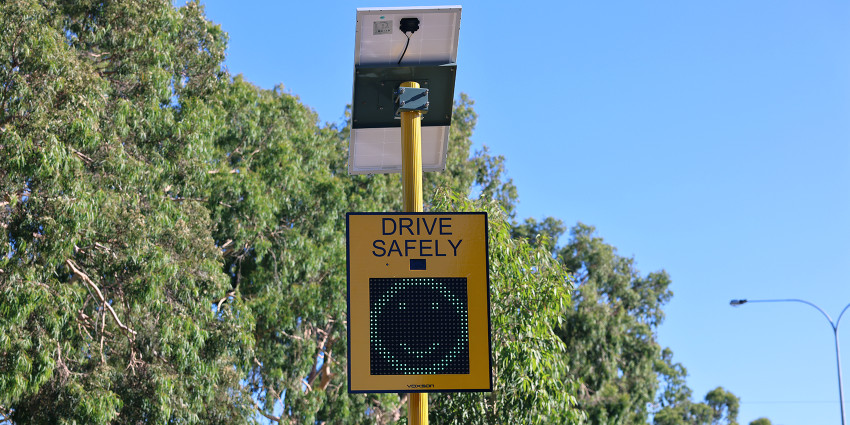 An electronic sign smiley face that indicates speed 