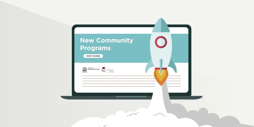 laptop screen with text announcing new program. A cartoon rocket emoji is in front of the screen