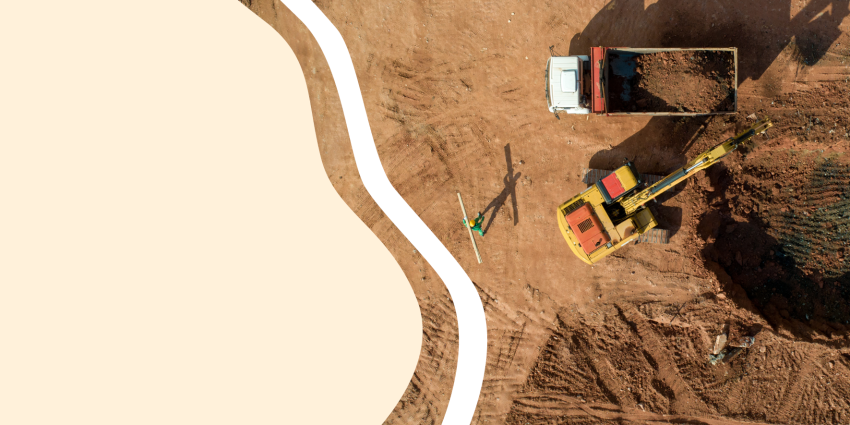 overhead photo of a dump truck and excavator digging