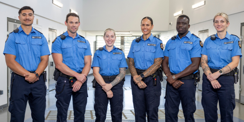 Prison Officers standing as a group