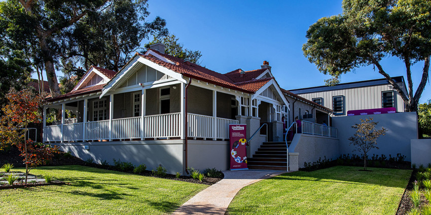 the front of a beautiful character home, including the front garden 