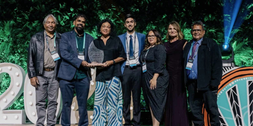 A group of people standing with their award for the 2026 Australian Institute of Aboriginal and Torres Strait Islander Studies (AIATSIS) Summit Awards for Excellence in Sustainability and Sustainable Futures
