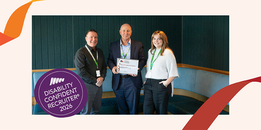 Three Department of Communities staff holding the Department's "Disability Confident Recruiter 2026" certificate of completion award
