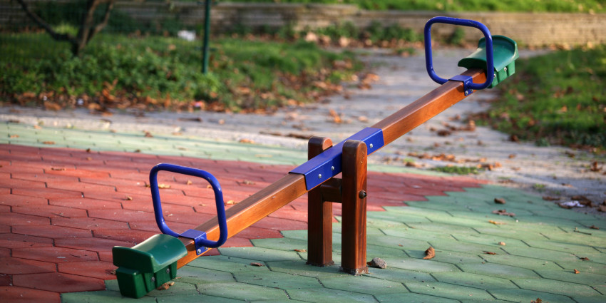 a see saw in a children's playground - no children present