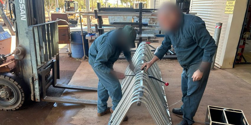 Prisoners building bicycle racks for the community at the prison’s Industries workshop.