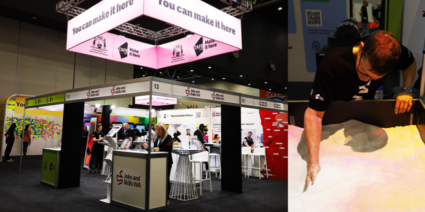 TAFE WA and Jobs and Skills WA booth at the SkillsWest Expo 2026 featuring the TAFE 'You can make it here' signage, information displays, visitors and an interactive sand-table exhibit.