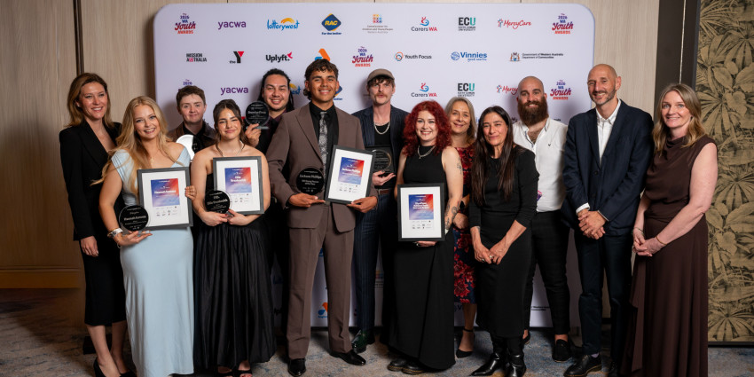 a group of adult people on stage, well dressed, smiling and celebratory at the 2026 WA Youth Awards Ceremony