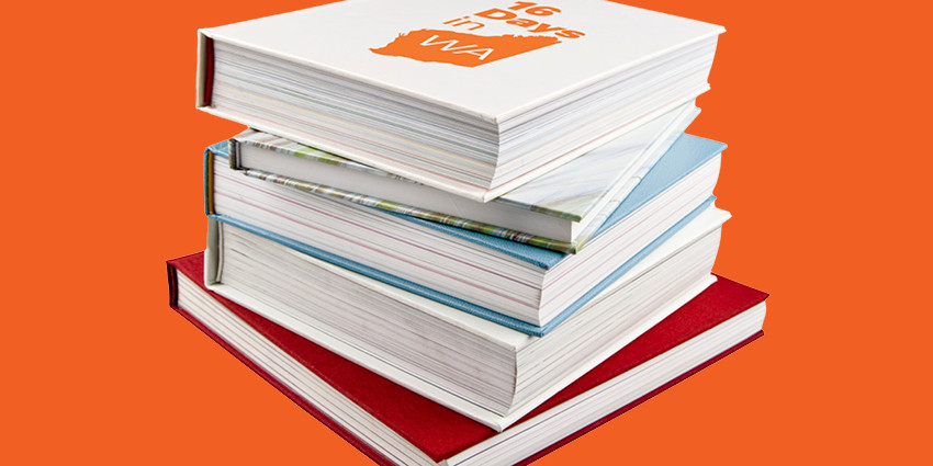 several books stacked on top of each other, including on that says '16 Day in WA'