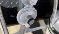 Compact metal regulator fitted to the gas system of Snowy River and Newgen caravans.