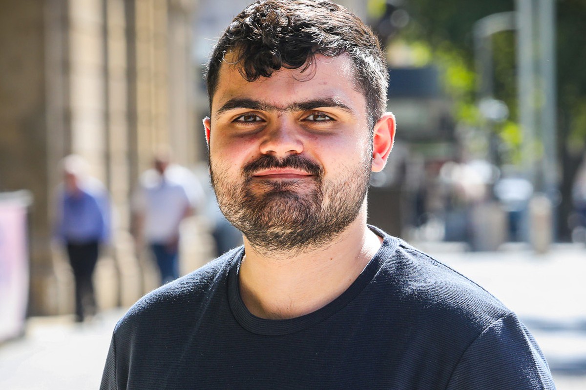 Head and shoulders photo of a male Youth Ambassador named Samuel