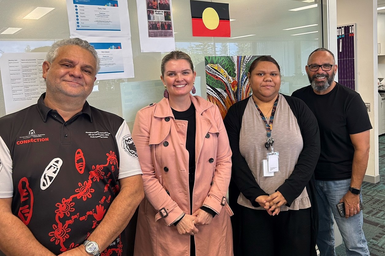Photo of four Communities Mid-West Gascoyne team members in an office environment