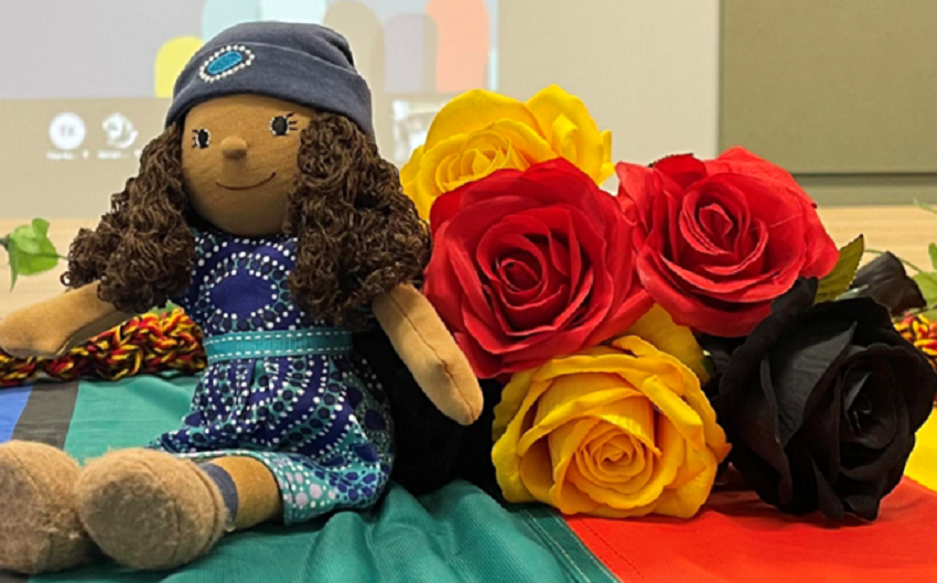 Soft toy Kaya with decorative flowers: Kaya and her garden of colour. Supporting children in care have pride in themselves and their culture.