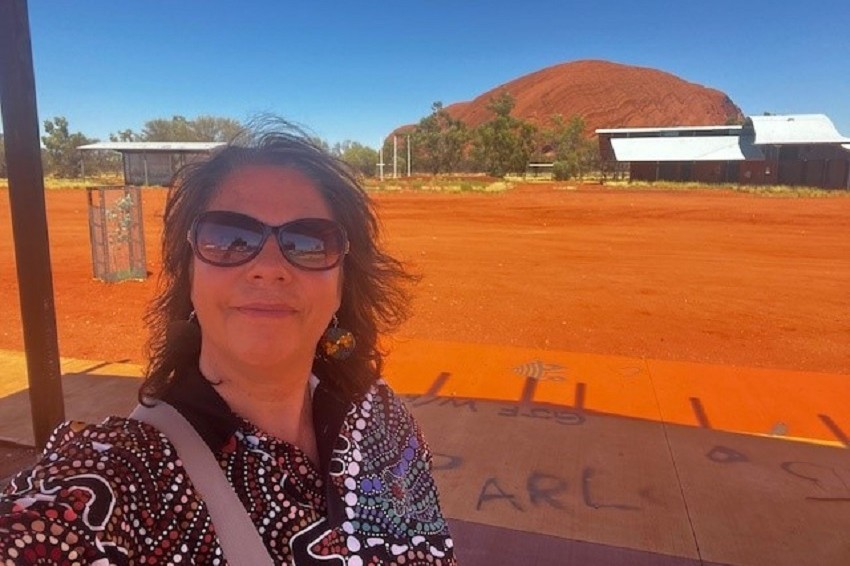 Communities staff member and advocate for truth telling Renae Walley photographed with a northern Australia landscape in the background