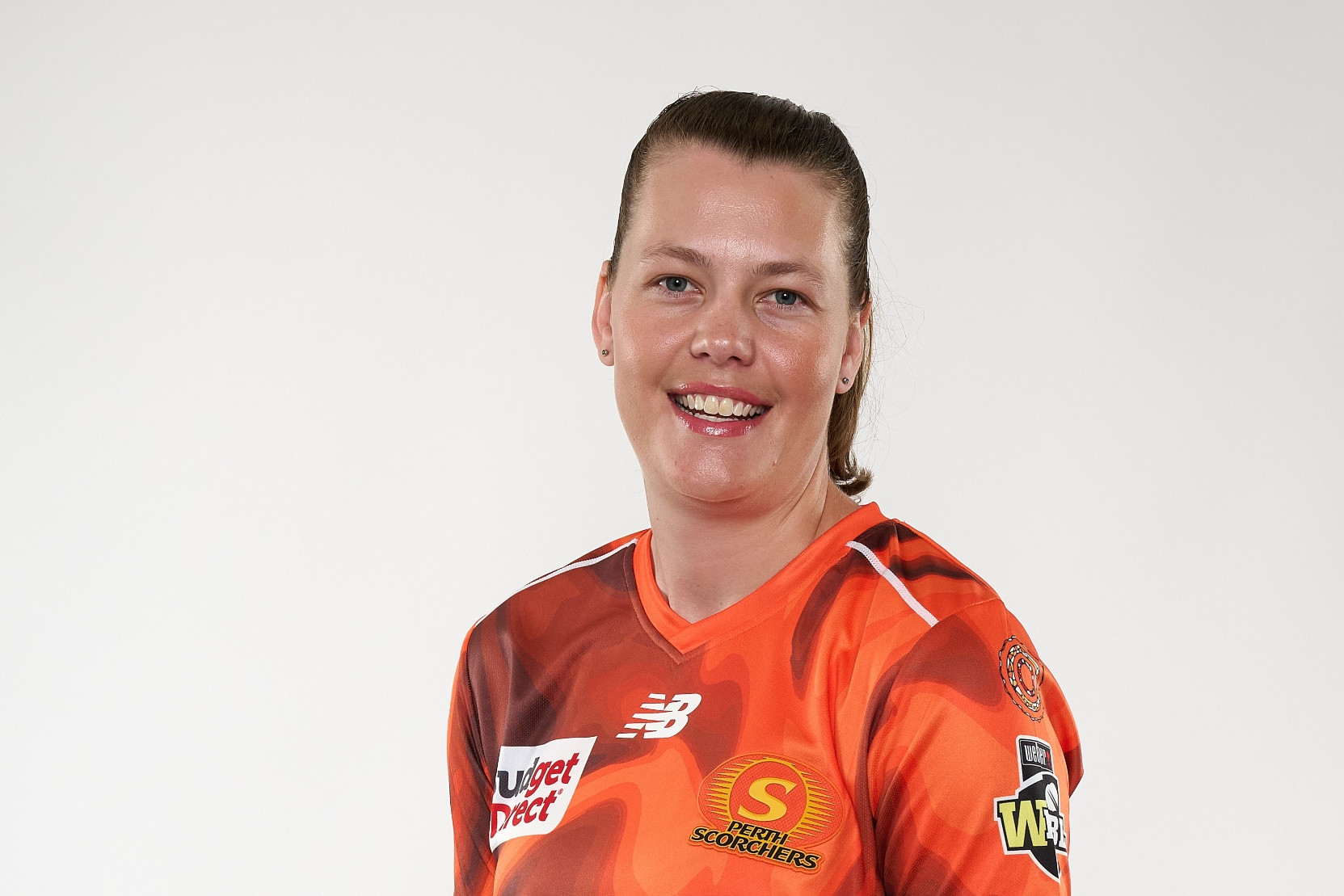 a sportswoman wearing cricket clothes