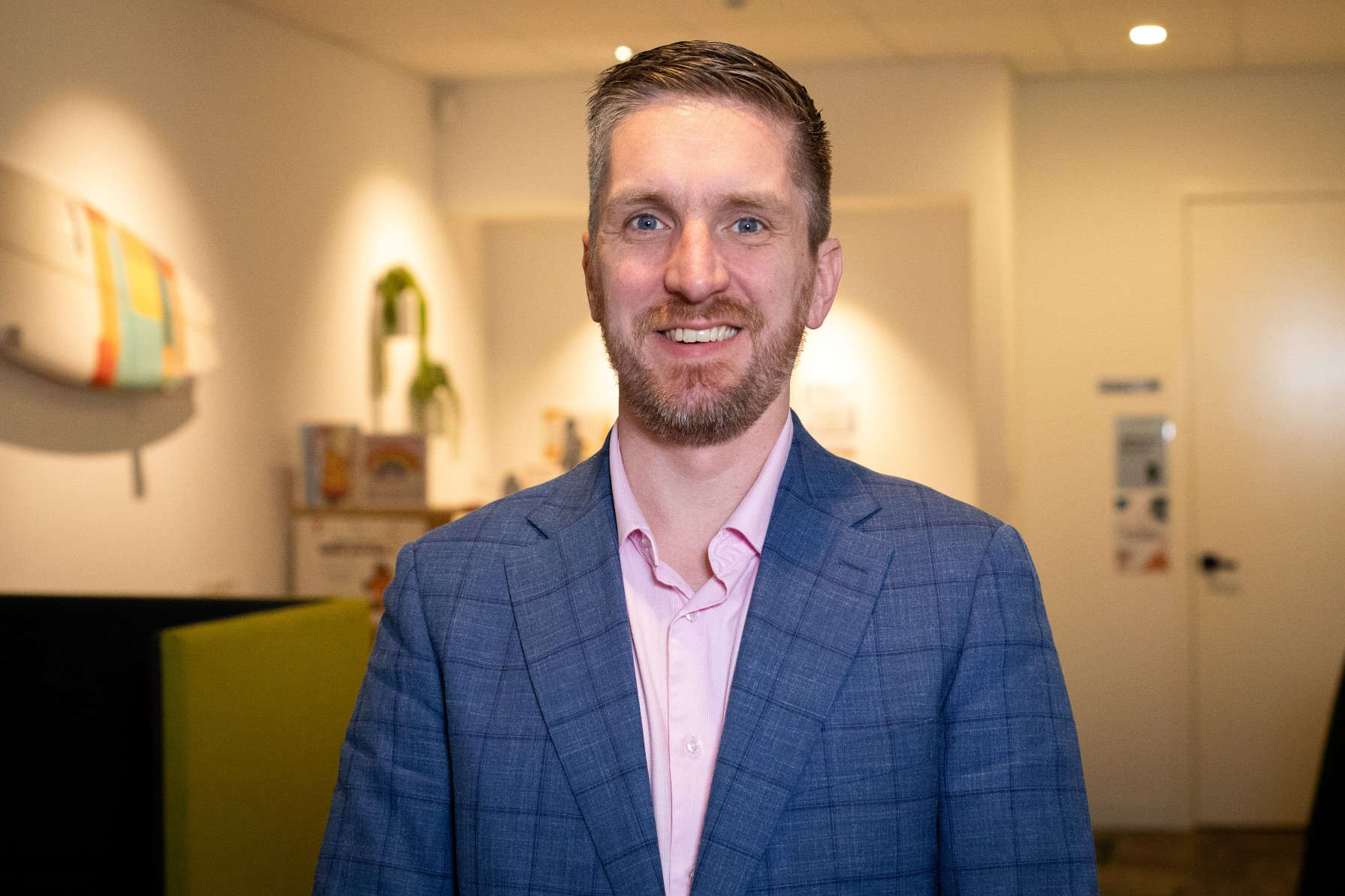 A man dressed in a suit in an office work environment