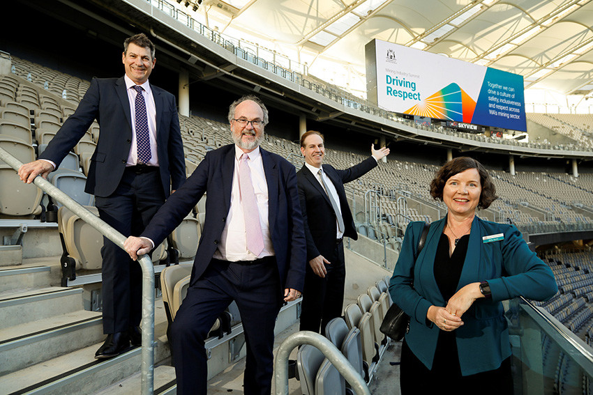 The Optus Stadium scoreboard displayed the Mining Industry Summit 2023: Driving Respect branding.